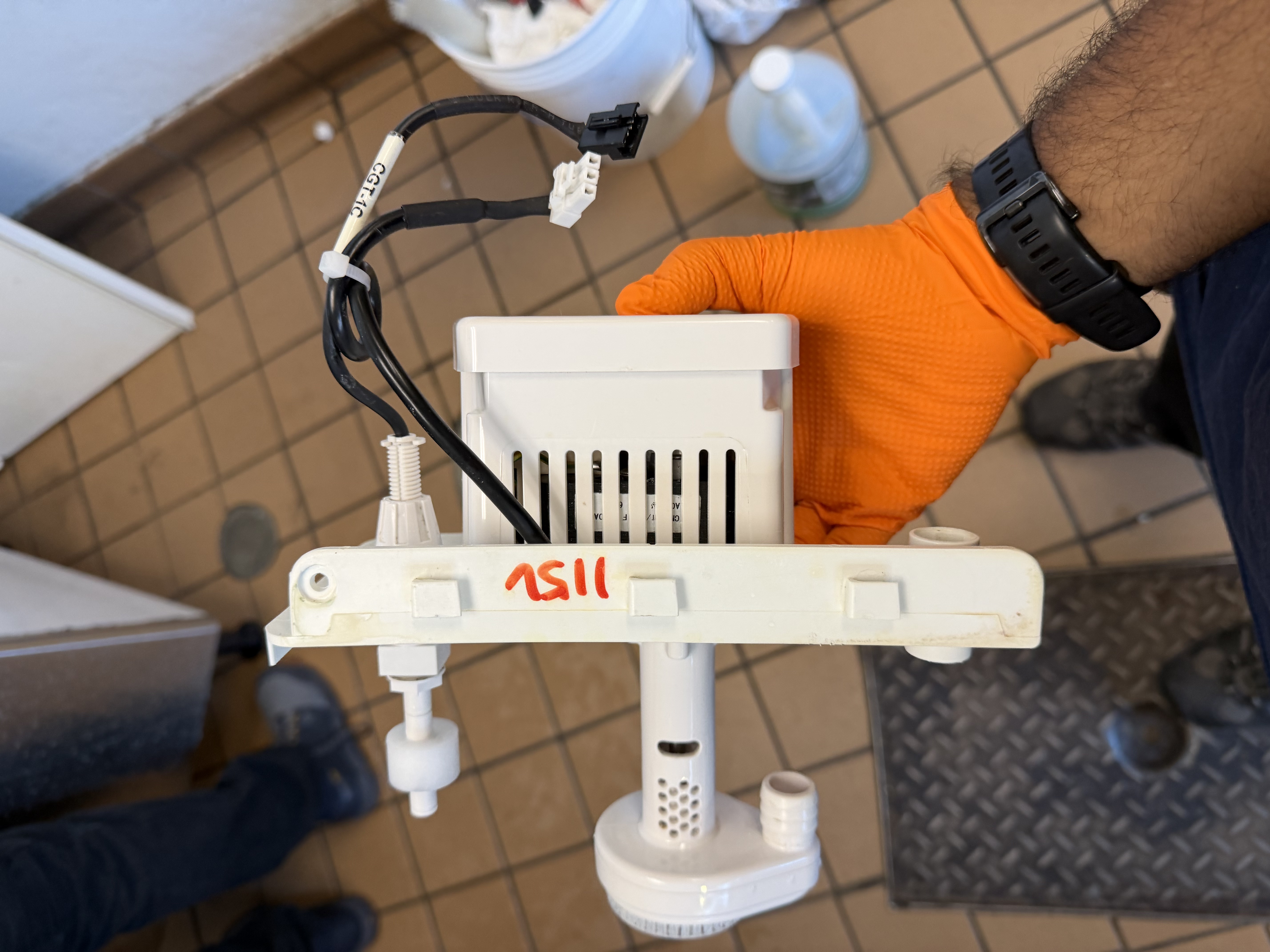 Clean water pump from a commercial ice machine after maintenance