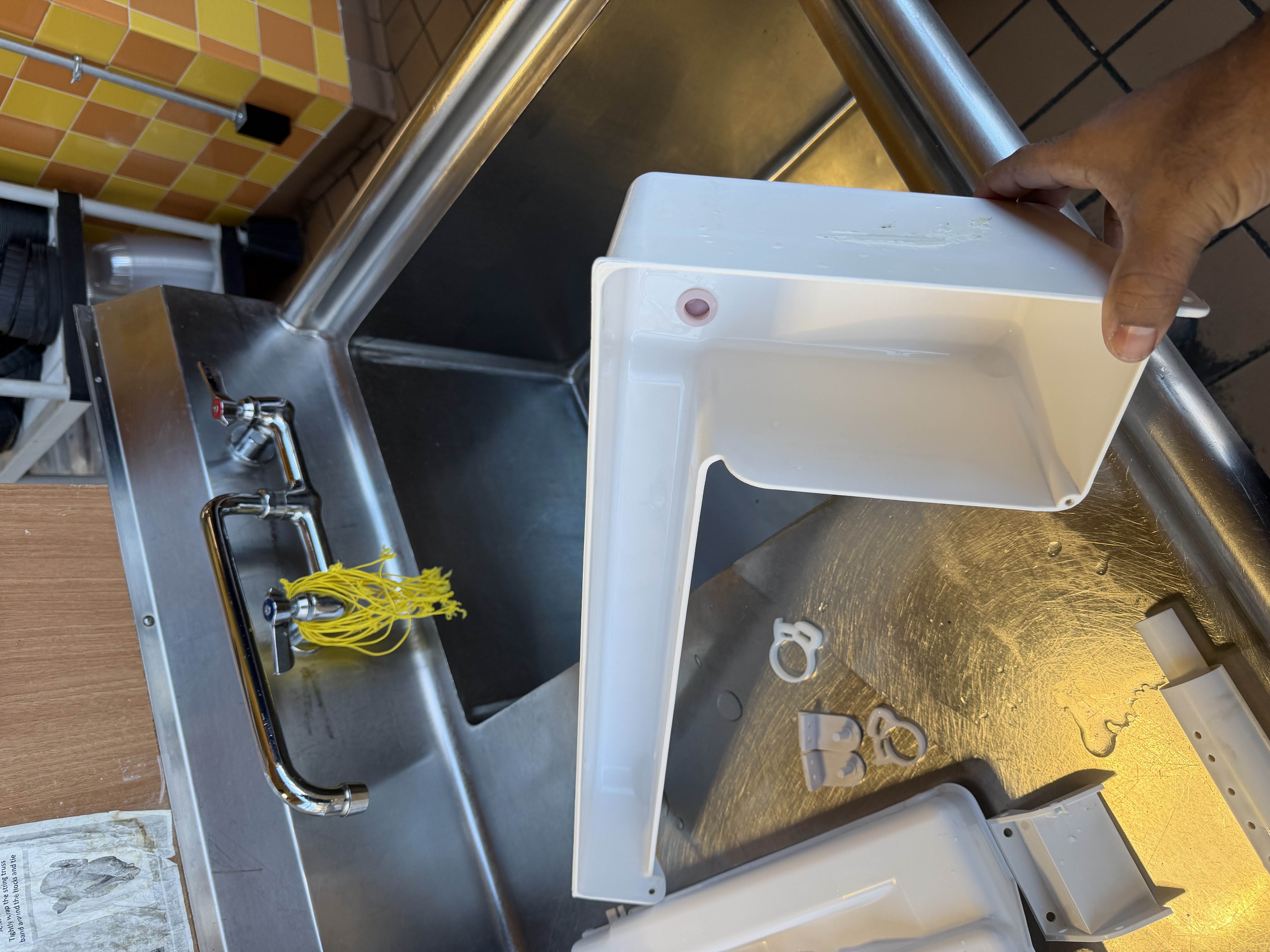 Clean water reservoir tank from a commercial ice machine after maintenance