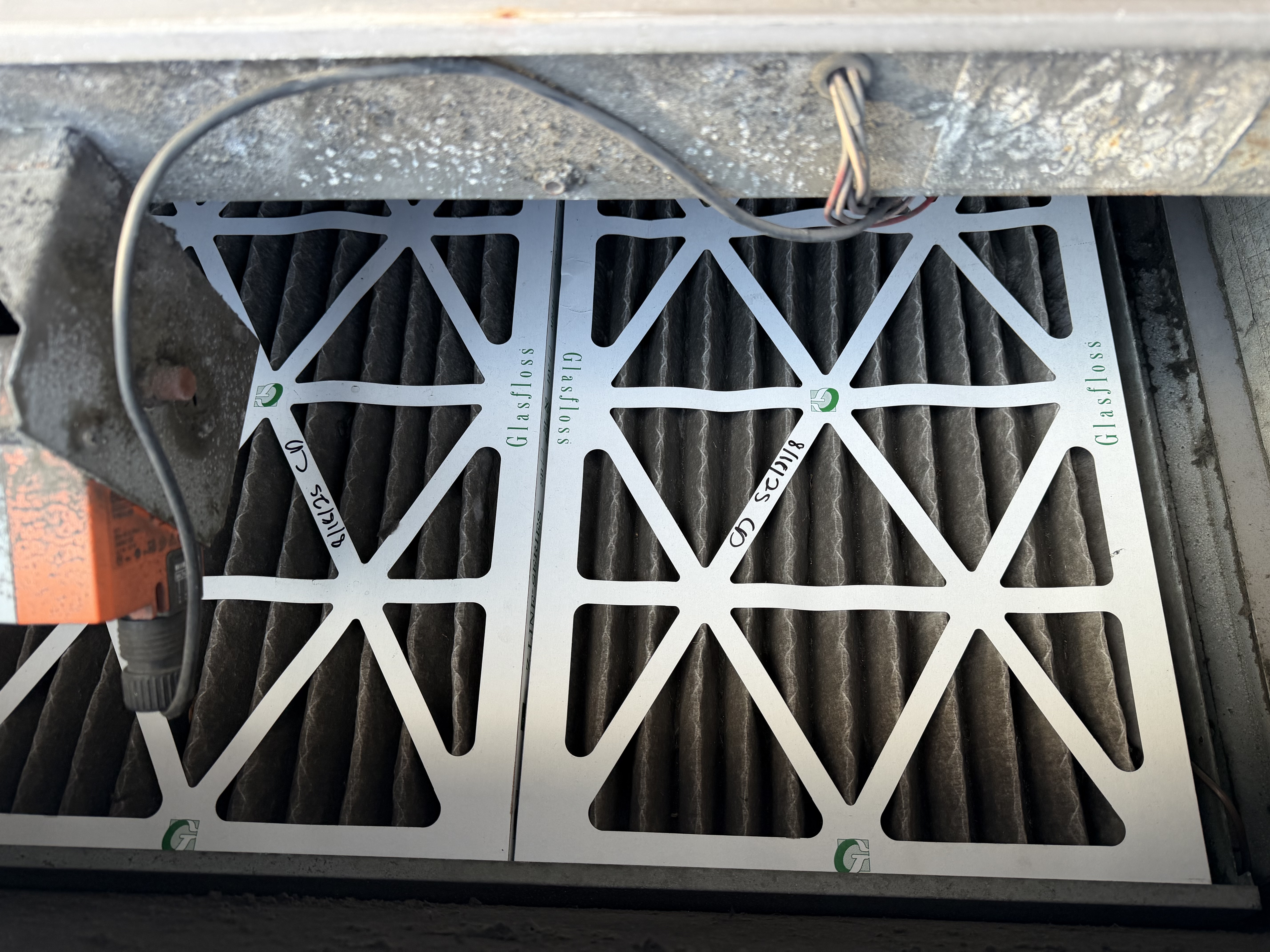 Dirty rooftop unit filters before commercial HVAC maintenance