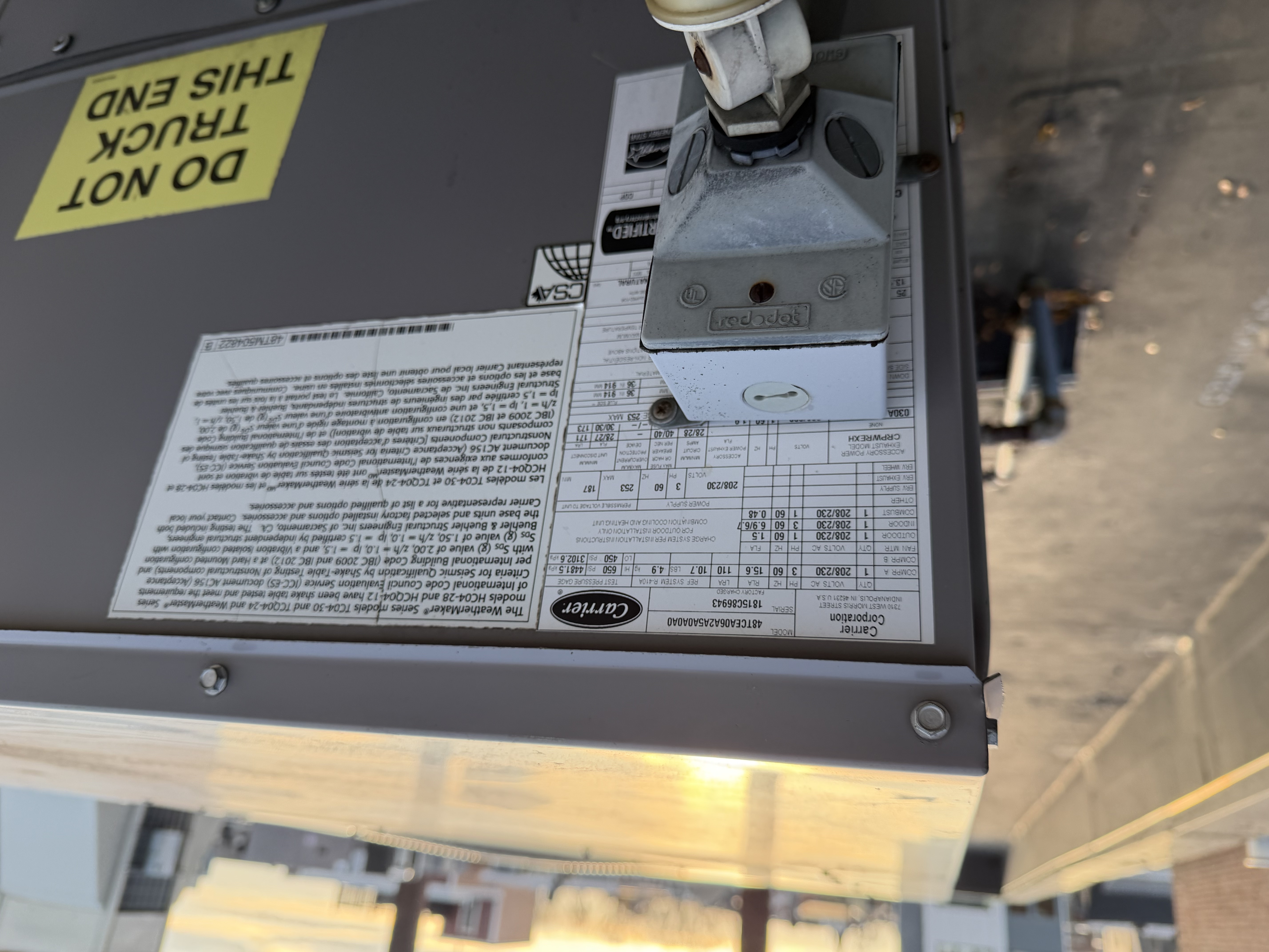 Commercial rooftop HVAC unit context photo during filter service