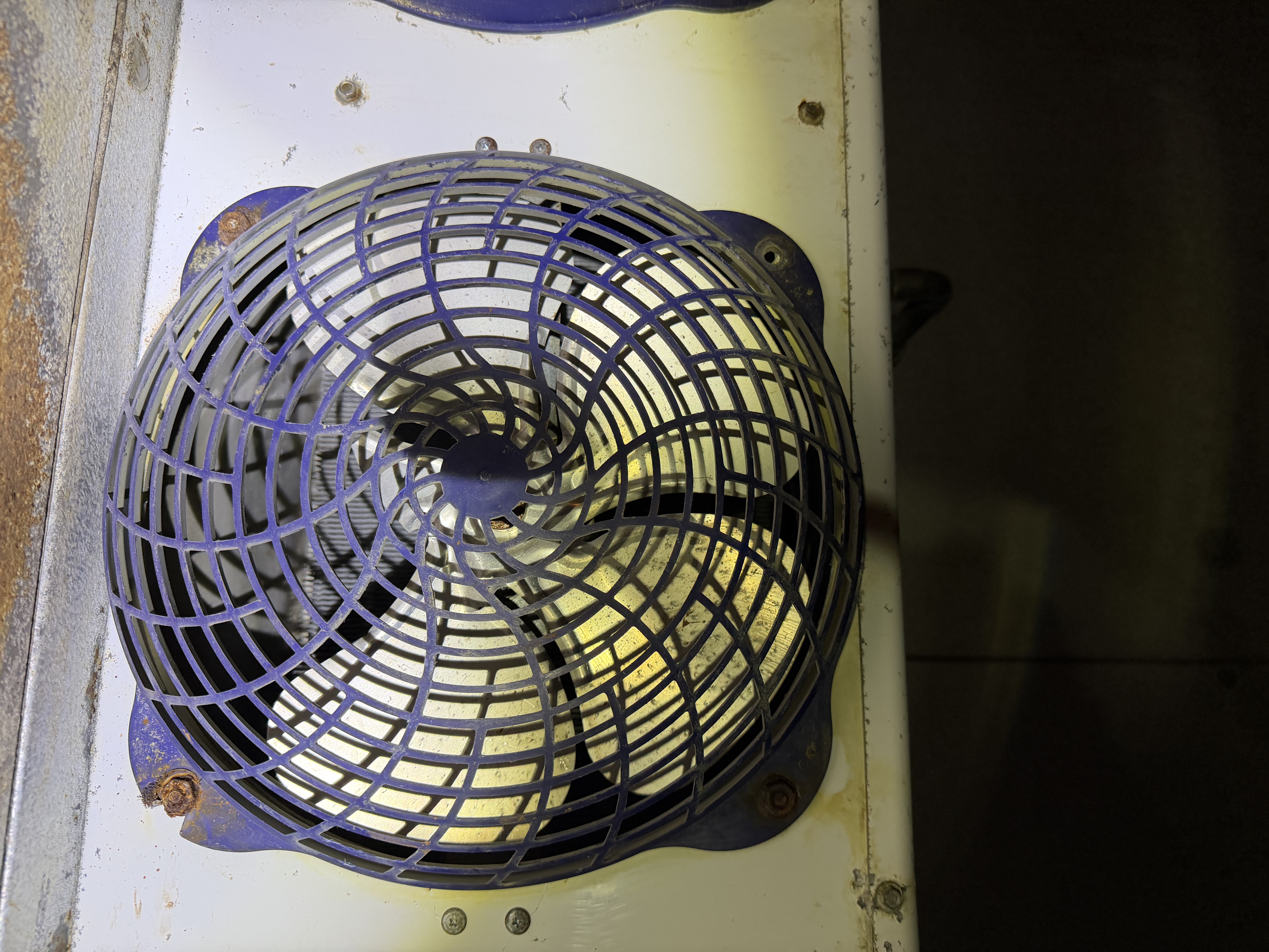 Walk-in freezer evaporator fan with a broken blade affecting airflow